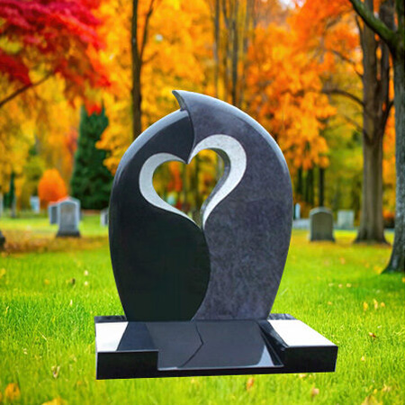 "Sculptural black and blue granite upright headstone with curved twin panels and heart-shaped cutout mounted on polished rectangular base—symbolizing unity and remembrance."