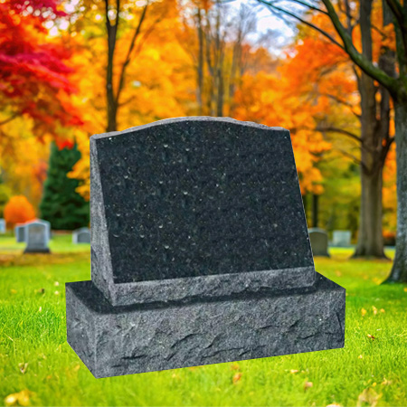 "Black emerald granite slant upright headstone monument with polished face and chiseled edge finishes, mounted on a granite base in a peaceful autumn cemetery setting."