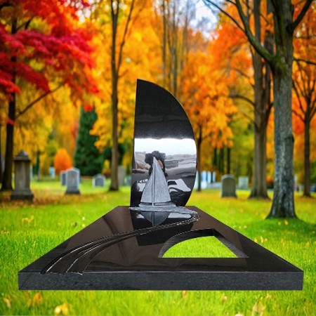 "Black granite upright memorial monument with engraved sailboat motif and polished full-length ledger slab—symbolizing eternal nautical journey."