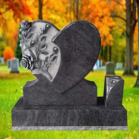 "Grey granite upright heart-shaped headstone with carved roses and polished rectangular base—crafted for emotional tribute and engraved remembrance."