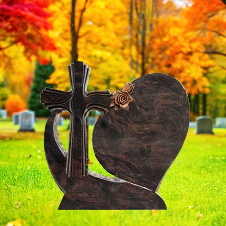 "Brown granite upright headstone memorial with carved cross, heart, rose motif, and polished base—symbolizing faith, love, and remembrance."