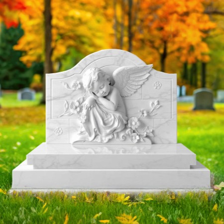 "White marble upright headstone memorial with sculpted resting cupid, floral carvings, and tiered base—symbolizing innocence and spiritual grace."