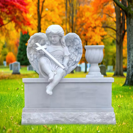 "White marble upright headstone memorial with sculpted cupid holding cross, flower vase, and split chiseled base—symbolizing spiritual protection and eternal remembrance."