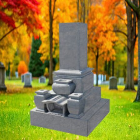 "Japanese granite headstone featuring tiered central pillar, recessed flower holders, and incense stands—crafted for ancestral tribute and ritual offerings."
