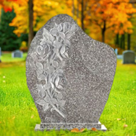 "Light brown granite upright headstone with floral carving, curved top shoulders, polished inscription panel, and rectangular base—symbolizing grace and sacred legacy."