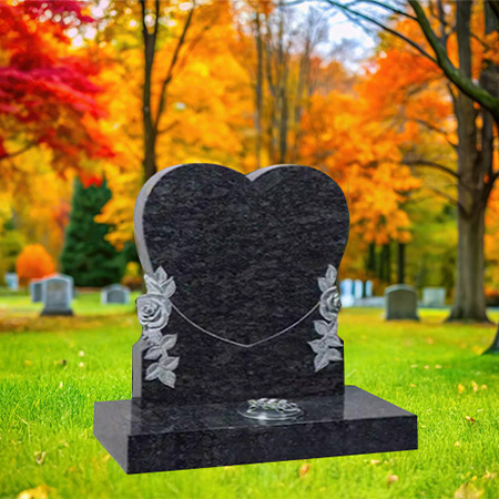 "Upright heart-shaped headstone in Pearl Blue granite with cascading rose carvings, polished base, and integrated flower container."