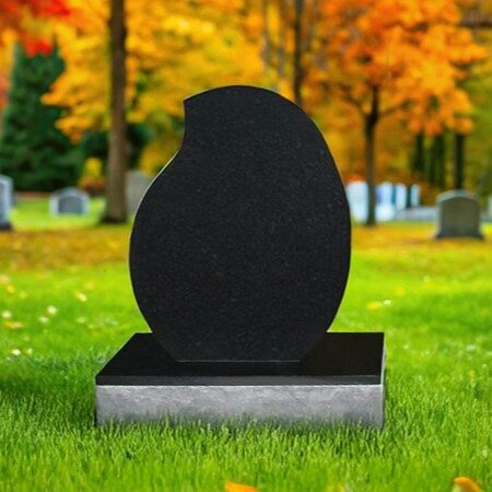 "Polished black granite upright teardrop headstone with chiseled-edge base—crafted for graceful tribute and inscription."