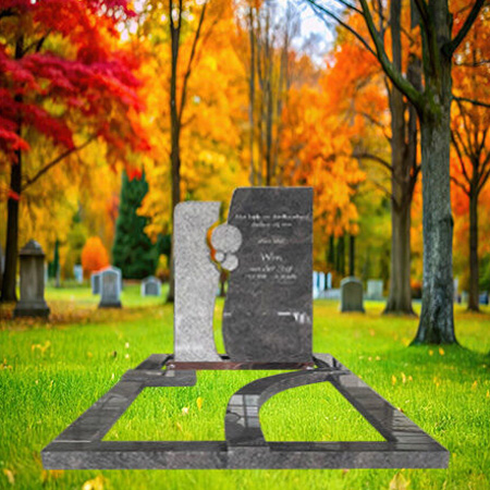 "Split-form upright headstone in light and dark grey granite with circular design, enclosed by full kerb set memorial configuration."