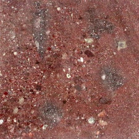 Ocean Red granite sample with warm red tones and subtle veining