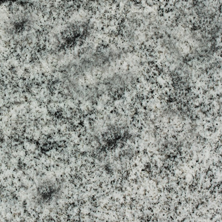 Viskont White granite headstone with flowing grey veins and marble accents