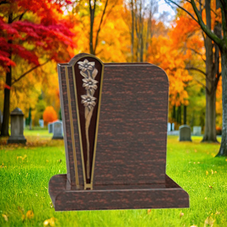 "Polished dark brown granite upright headstone with bronze flower insert on the left panel, set on a rectangular base in a serene autumn cemetery setting."
