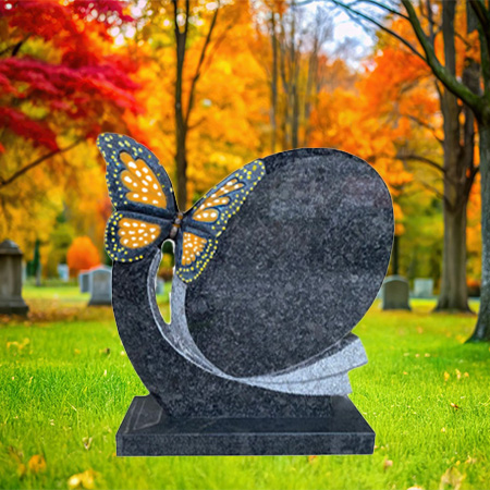 "Polished Pearl Blue granite upright headstone with sculpted butterfly accent, mounted on a matching granite base."