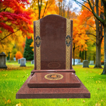 "Polished red granite upright headstone with gold detailing on both sides and circular emblem at the base."