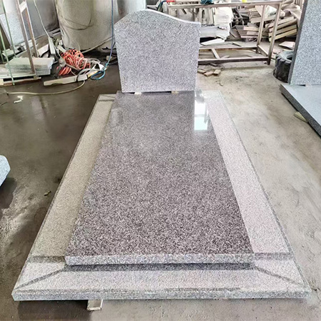 "Grey polished granite upright headstone with rectangular shape and full-length ledger featuring elevated center."