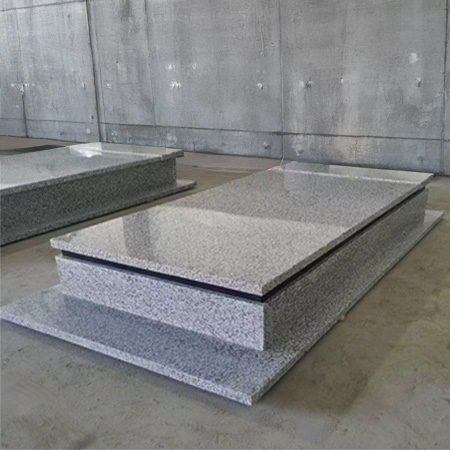 "Grey polished granite flat ledger monument with multi-level rectangular slab design."