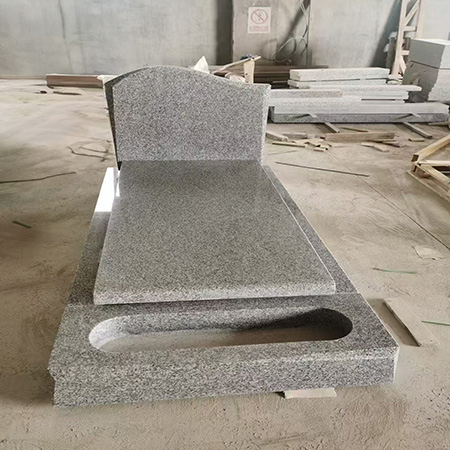 "Grey polished granite upright headstone with rectangular shape and full-length ledger featuring recessed center."