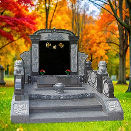 "Gray granite canopy-style monument with black central plaque, two portrait inserts, lion statues, floral carvings, and stepped platform."