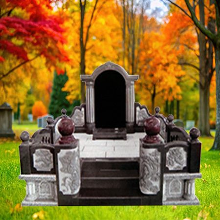 "Stone canopy-style headstone with arched alcove, carved pillars, spherical finials, and stepped platform base."